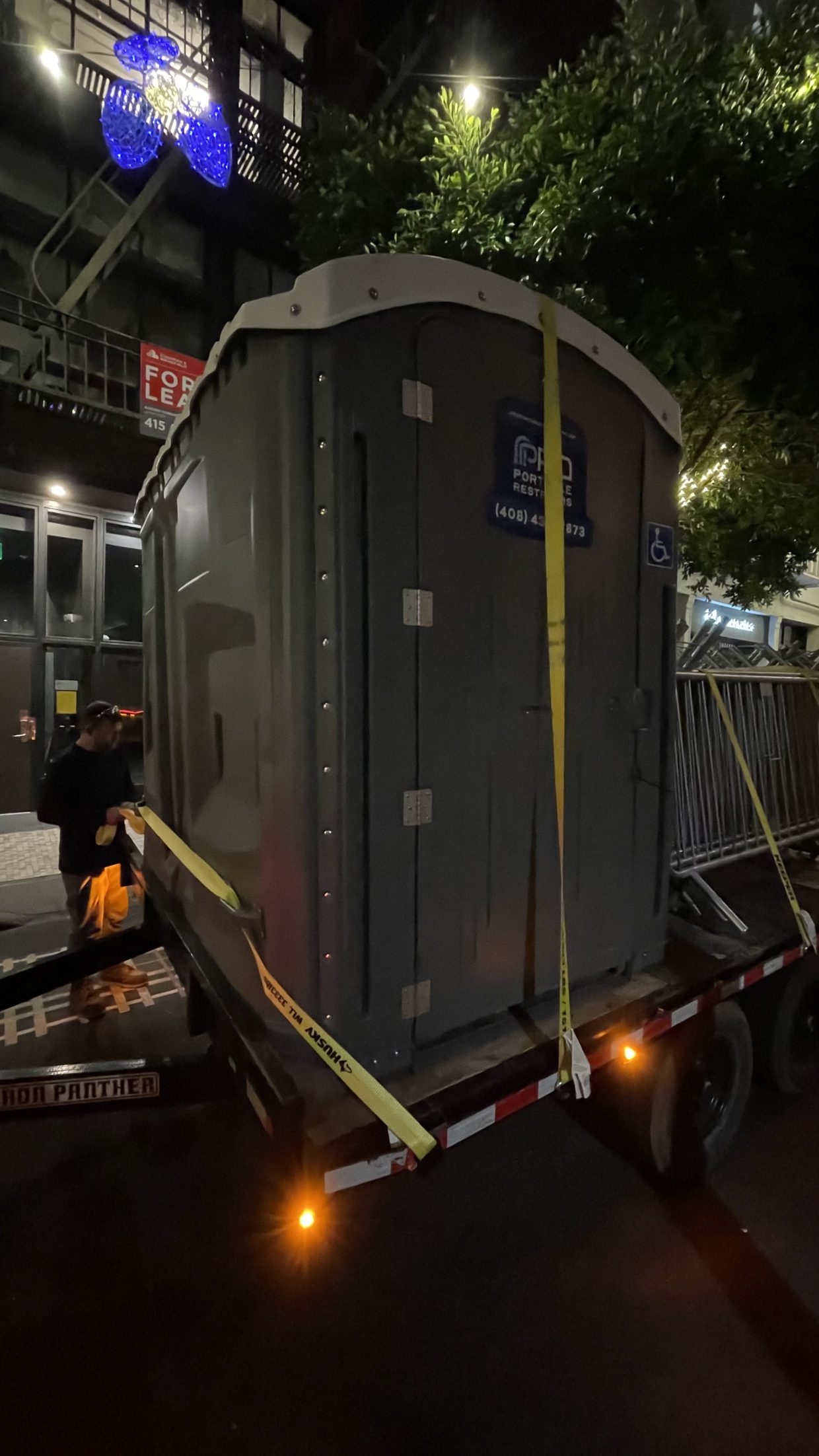 Portable restrooms delivered and serviced for a nighttime event
