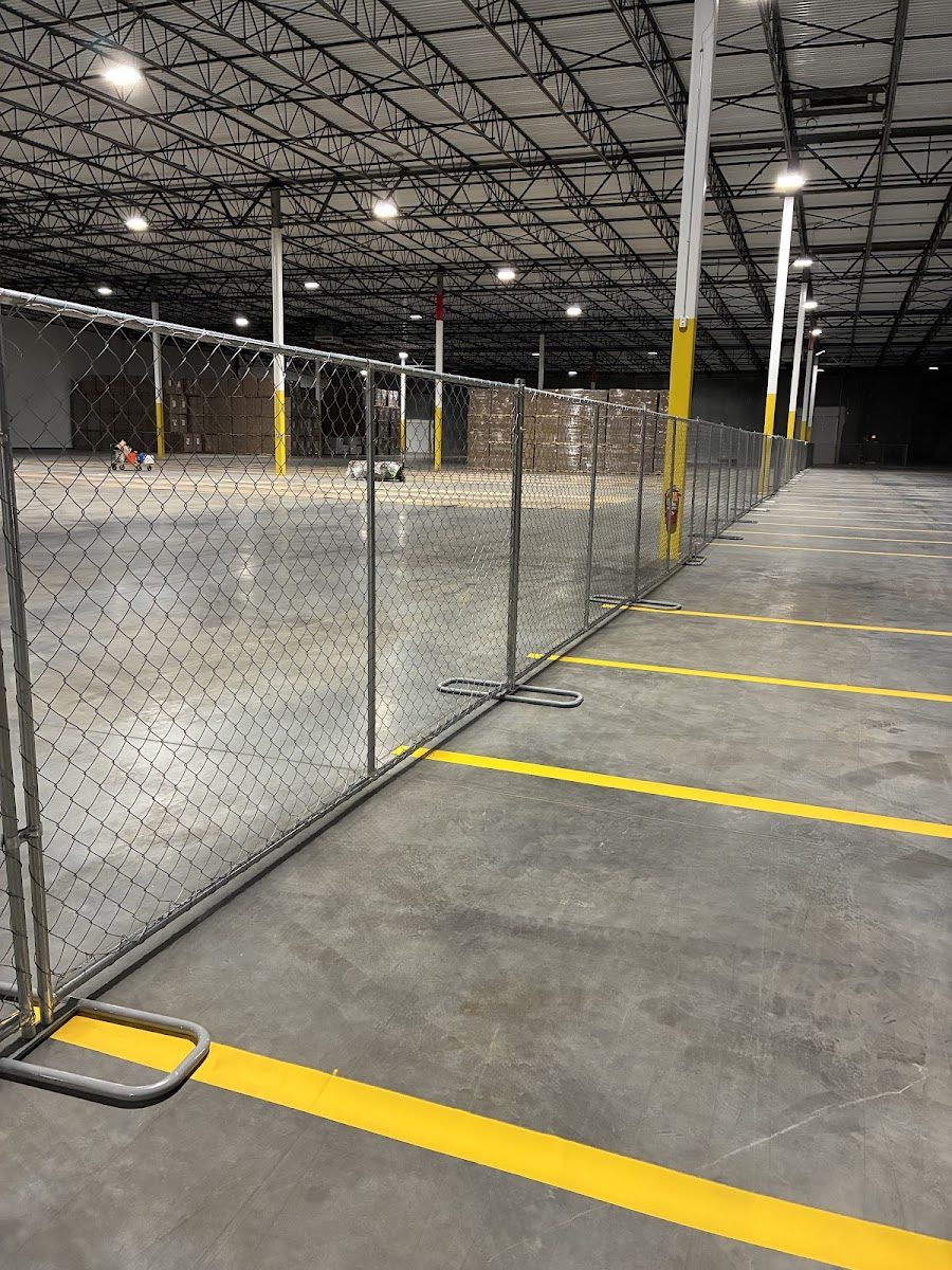 Temporary chain-link fence panels installed to secure a work site